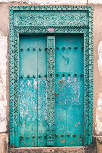 Blue closed door of old building