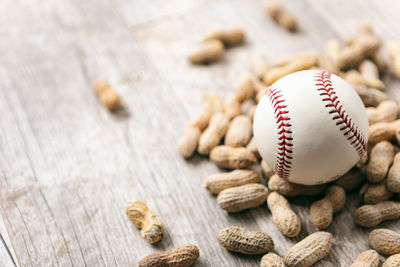 Close-up of baseball on wooden table