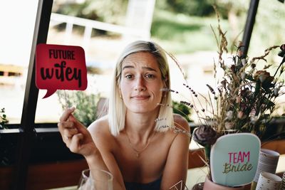 Portrait of woman with text on bachelorette party