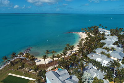 High angle view of swimming pool by sea against sky