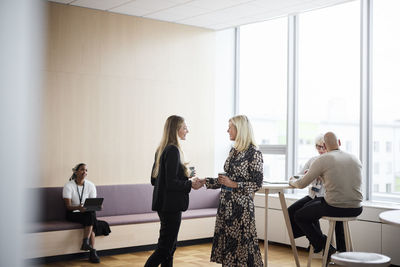 Businesswomen talking during coffee break