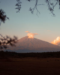 Scenic view of mountains against sky during sunset