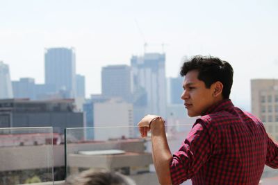 Man standing on building terrace