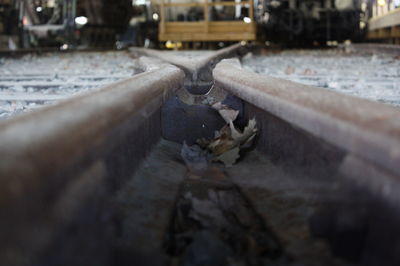 Close-up of old rusty wheel in city