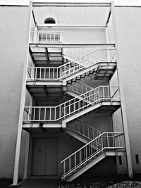 Metallic staircase against building