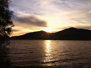 Scenic view of lake at sunset