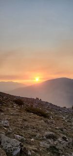 Scenic view of landscape against sky during sunset