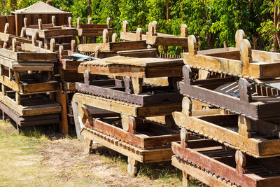 Old wooden sunbeds. thrown away vintage sun loungers for recycling