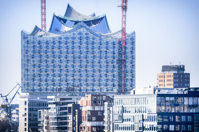 Low angle view of buildings against blue sky