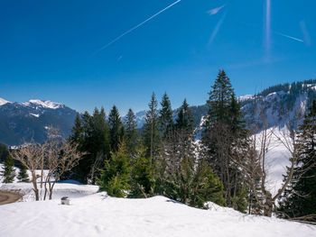 Scenic view of snow covered mountains against sky