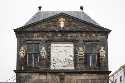 Low angle view of old building against sky