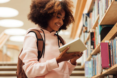 Portrait of young woman using mobile phone