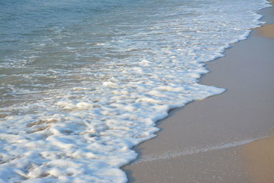 High angle view of surf on beach