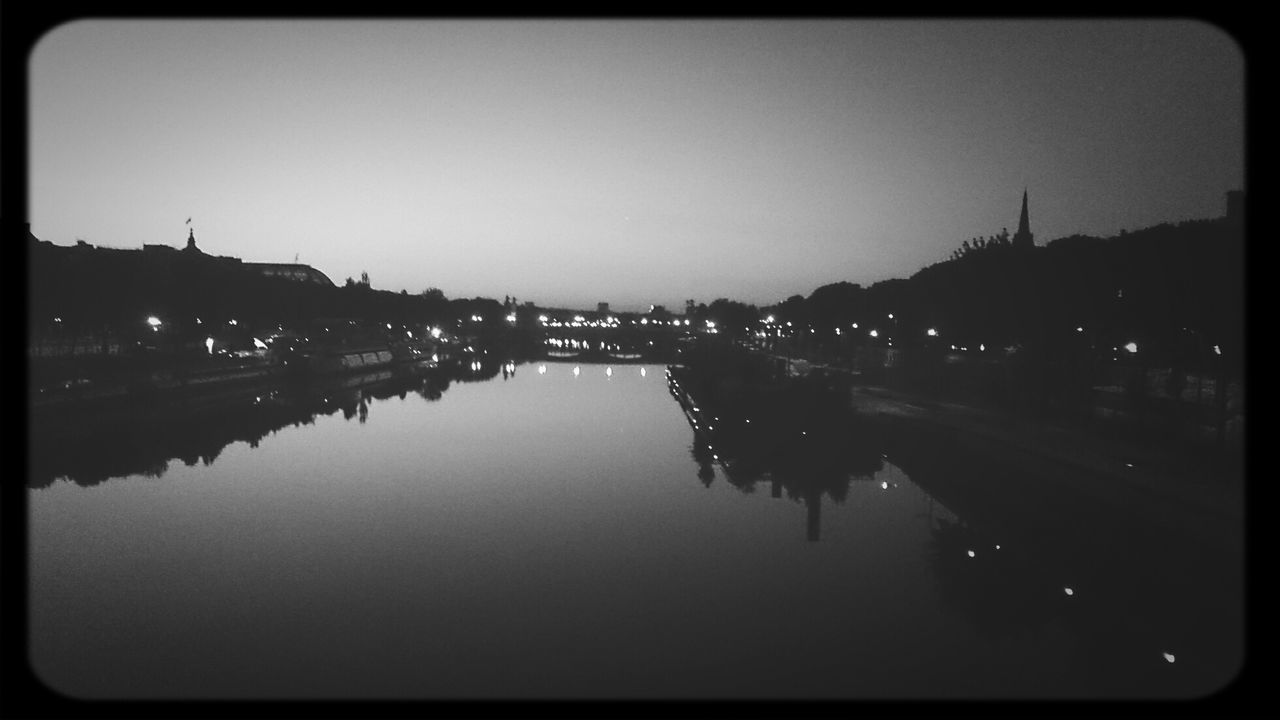 transfer print, reflection, water, building exterior, illuminated, architecture, built structure, waterfront, night, auto post production filter, river, city, clear sky, sky, copy space, dusk, lake, standing water, outdoors, silhouette