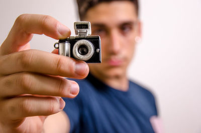 Close-up portrait of man photographing