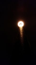 Illuminated street light at night