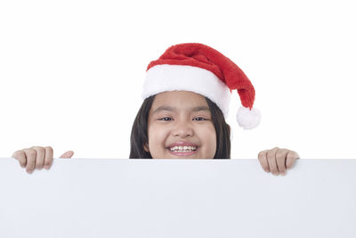 Portrait of a smiling girl over white background