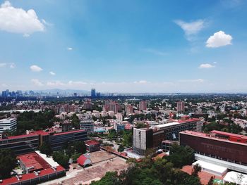 High angle view of buildings in city against sky