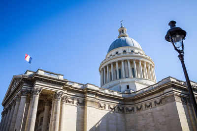 Low angle view of building against blue sky