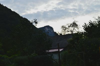 Scenic view of mountains against cloudy sky