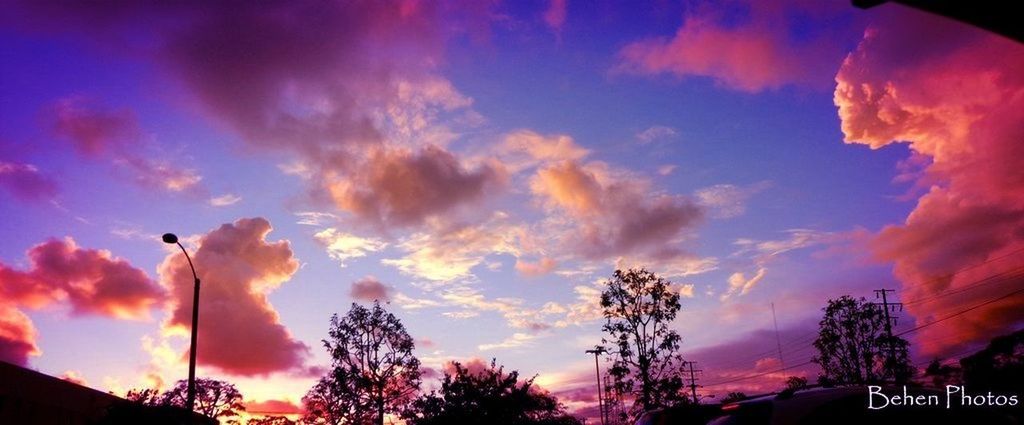 sky, sunset, cloud - sky, low angle view, silhouette, tree, cloud, cloudy, beauty in nature, nature, street light, scenics, dusk, orange color, dramatic sky, outdoors, tranquility, no people, pink color, transportation