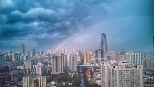 Modern buildings in city against sky