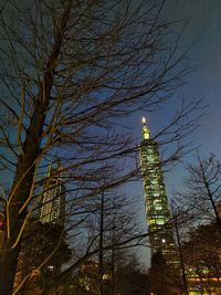 Low angle view of illuminated building against sky at night