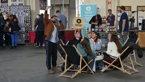 People sitting on chair in city