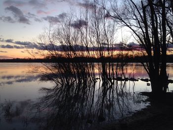 Scenic view of lake at sunset
