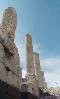 Low angle view of old ruin building against sky