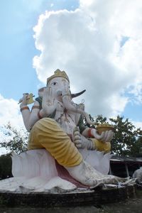 Low angle view of statue against sky