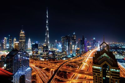 Illuminated buildings in city at night