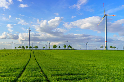 Wind turbines in front of a cloudy sky