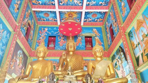 Statue in temple outside building