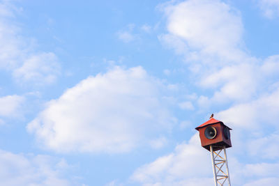 Low angle view of road sign against sky