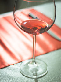 High angle view of wine in glass on table