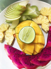 High angle view of fruits in plate on table