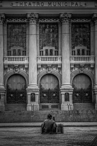 People sitting outside building