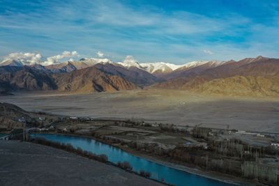 Scenic view of landscape and mountains against sky