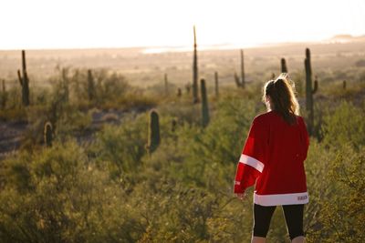 Rear view of man standing on field