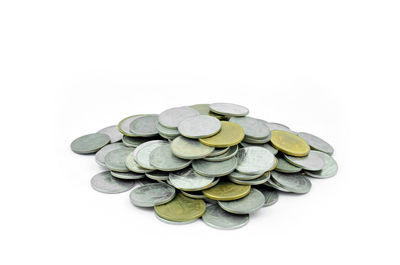 Close-up of coins on white background