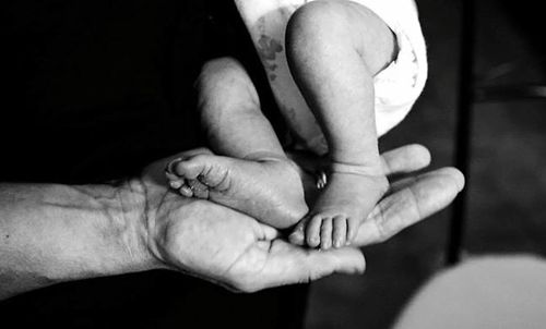 Cropped image of woman holding hands