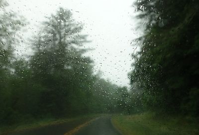 Full frame shot of wet glass window in rainy season