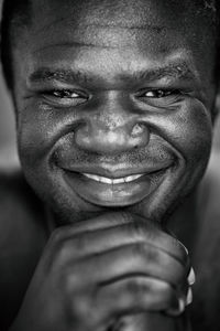 Close-up portrait of smiling mid adult man