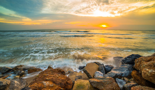 Scenic view of sea against sky during sunset