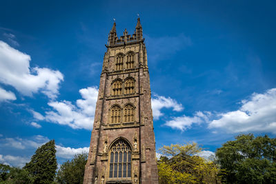 Low angle view of clock tower against sky