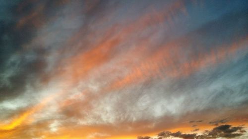 Low angle view of dramatic sky during sunset