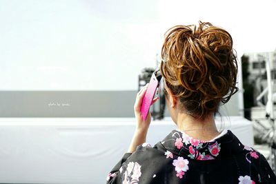 Rear view of a girl looking up