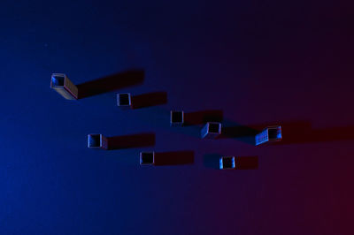 High angle view of illuminated lamp against blue sky