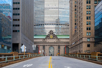 Road passing through city buildings